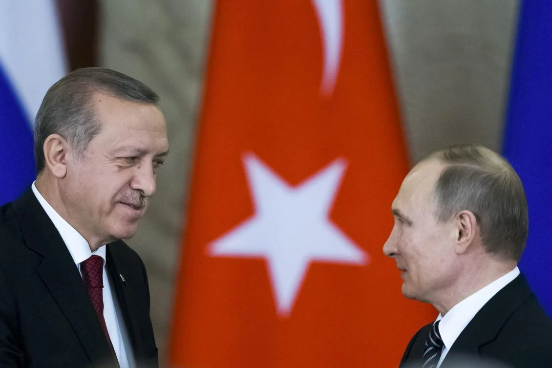 Russian President Vladimir Putin (R) shakes hands with his Turkish counterpart Tayyip Erdogan after the talks at the Kremlin in Moscow, Russia. (Reuters)
