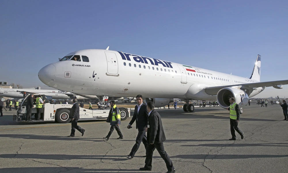 In this Jan. 12, 2017 photo, IranAir's new Airbus plane is being pulled while escorted by the airliner's staff after landing at Mehrabad airport, in Tehran. A second plane, an Airbus A330, arrived in the same airport on Saturday. (AP file photo)