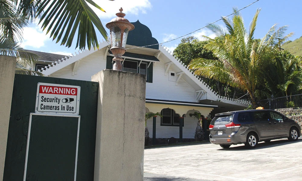 In this Feb. 9, 2017 file photo, a security camera warning sign is seen at the Muslim Association of Hawaii in Honolulu. (AP Photo/Jennifer Sinco Kelleher, File)