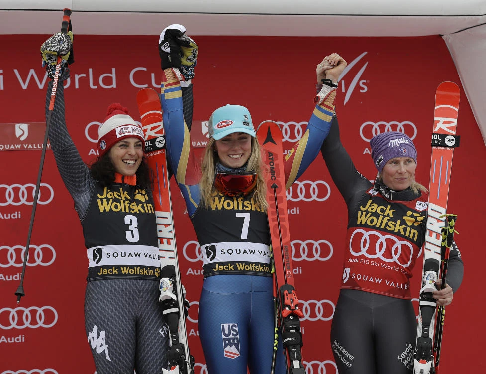 Mikaela Shiffrin, center, celebrates with Federica Brignone, left, and Tessa Worley, after finishing first in the women's World Cup giant slalom competition in Olympic Valley, California on Friday. (AP)