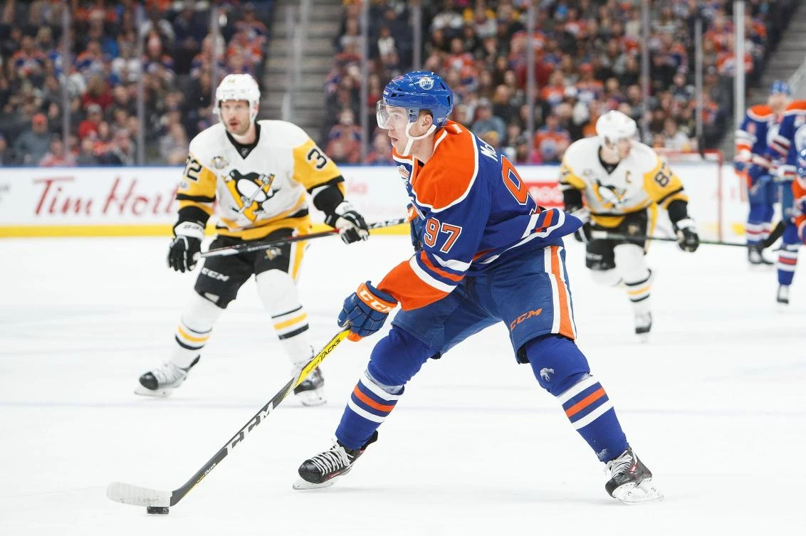 Connor McDavid (97) of the Edmonton Oilers looks for a shot against the Pittsburgh Penguins at Rogers Place in Edmonton, Alberta, Canada, on Friday night. (AFP)
