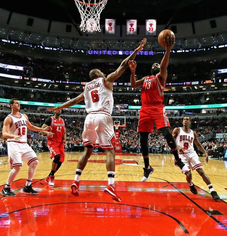 James Harden (13) of the Houston Rockets puts up a shot over Cristiano Felicio (6) of the Chicago Bulls at the United Center in Chicago, Illinois, Friday night. (AFP)