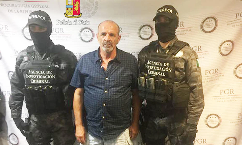 This handout picture released on March 11, 2017 by the Italian police (Polizia di Stato), shows fugitive Italian mobster Giulio Perrone, 65, arrested by police after being tracked down on Facebook. (AFP)