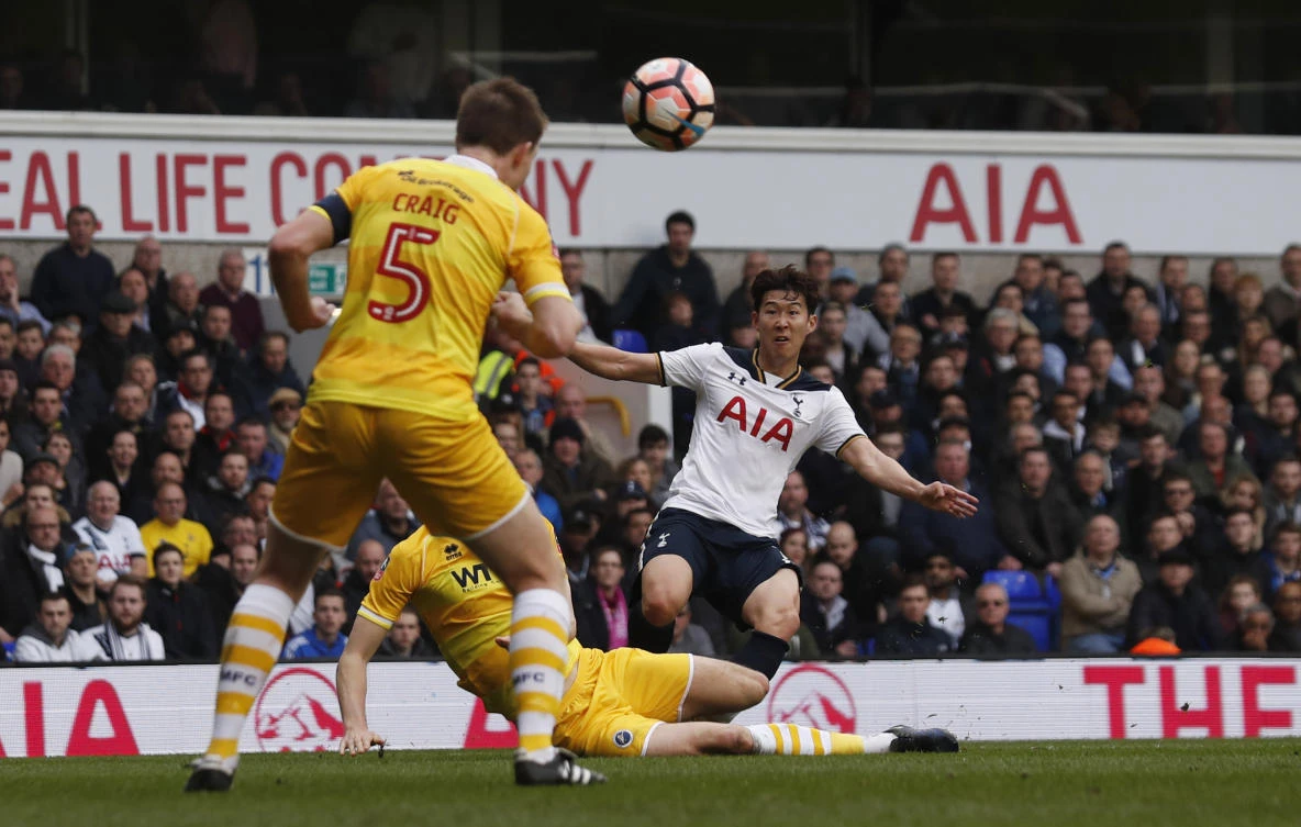 Tottenham's Son Heung-min scores the second goal against Millwall in the FA Cup quarterfinal at White Hart Lane on Sunday. (Reuters)