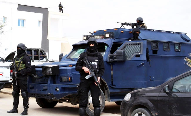 Tunisian police officers stand guard in Tunisia, near the Libyan border, in this file photo taken March 9, 2016. (REUTERS)