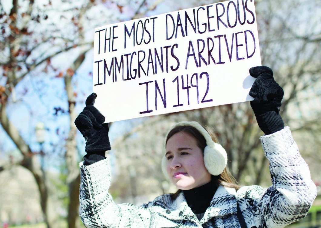 A demonstrator holds a sign near the White House to protest the US travel ban on six Muslim countries on Saturday in Washington. (AFP)
