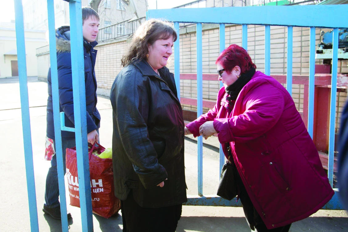 Oksana Sevastidi, center, escorted by her lawyer, left, leaves the Lefortovo prison in Moscow on Sunday. (AP)