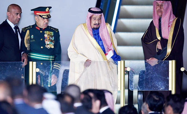 Saudi Arabian King Salman (C) gets off the plane upon his arrival at Haheda Airport in Tokyo on Sunday. (AFP)