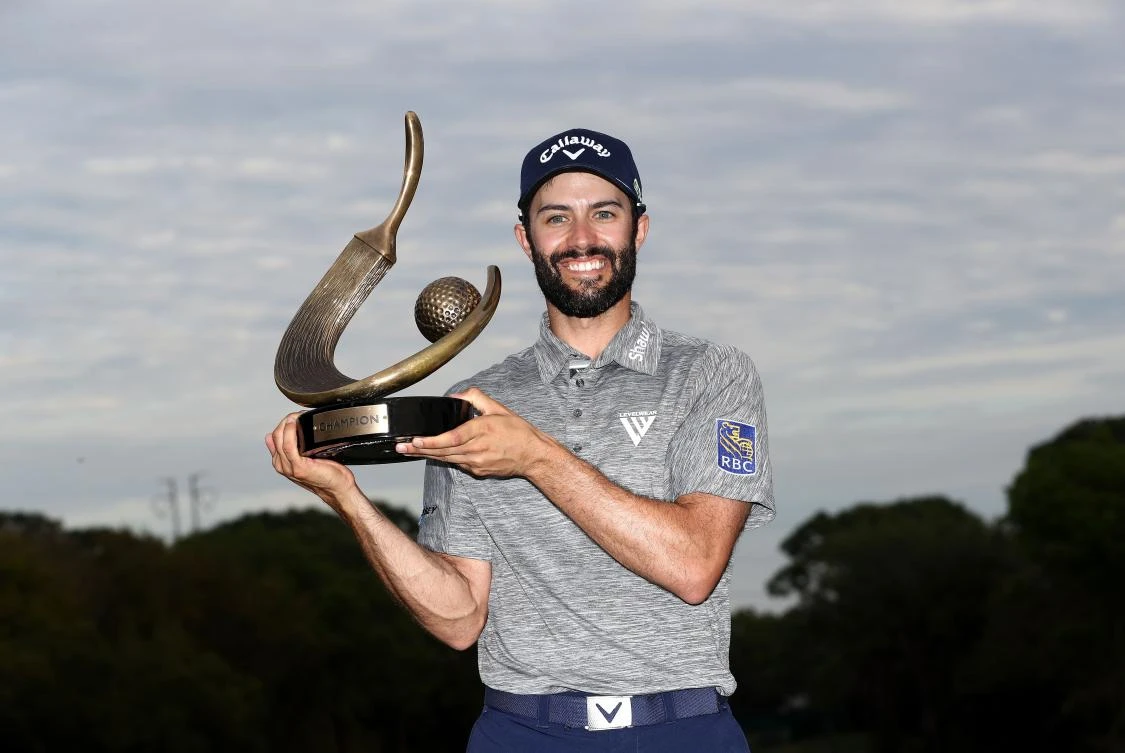 Adam Hadwin holds the trophy after winning the Valspar Championship during the final round at Innisbrook Resort Copperhead Course in Palm Harbor, Florida, on Sunday. (AFP)