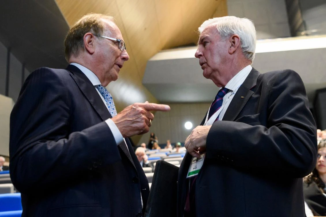 WADA President Craig Reedie, right, speaks with Canadian lawyer Richard McLaren who produced a report for the WADA which claimed that Russia had orchestrated state-sponsored doping at the 2014 Sochi Winter Olympics, during the WADA Annual Symposium in Lausanne on Monday. (AFP)