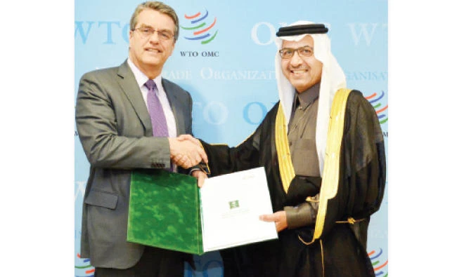 Saleh bin Eid Al-Hussaini submits his credentials as the Kingdom’s Permanent Representative to World Trade Organization (WTO) Director-General Roberto Azevedo, in Geneva on Friday. (SPA)