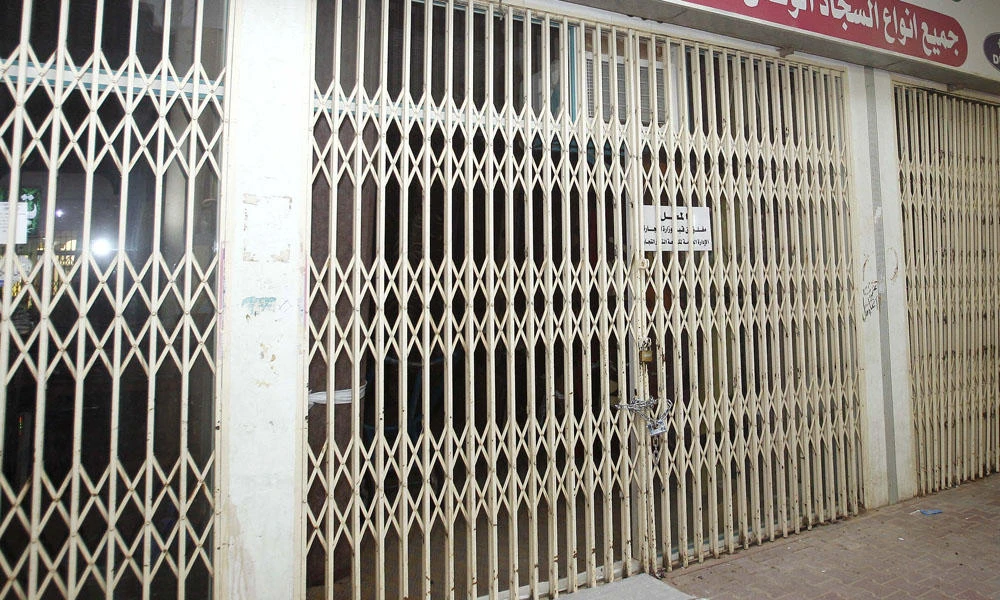 In this file photo, a furniture shop in Riyadh is padlocked for labor law violations. Authorities on Monday started clearing the capital’s neighborhoods of illegal markets operating on residential plots. (SPA file photo)