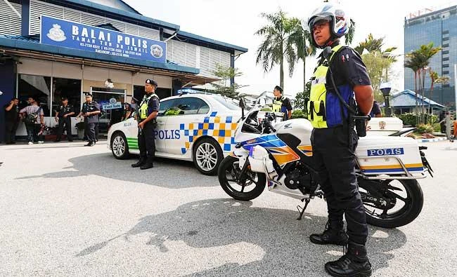 Malaysian police stand outside the station while the Inspector-General of Police Khalid Abu Bakar attends an event in Kuala Lumpur, Malaysia, in this March 10, 2017 photo. (AP)