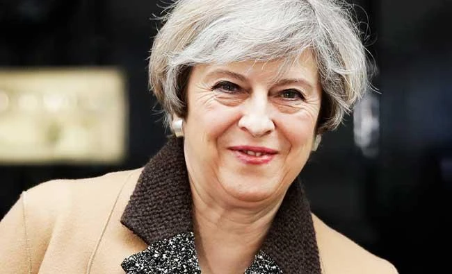 British Prime Minister Theresa May leaves 10 Downing Street on her way to the Houses of Parliament, in London, on Tuesday. (AP)