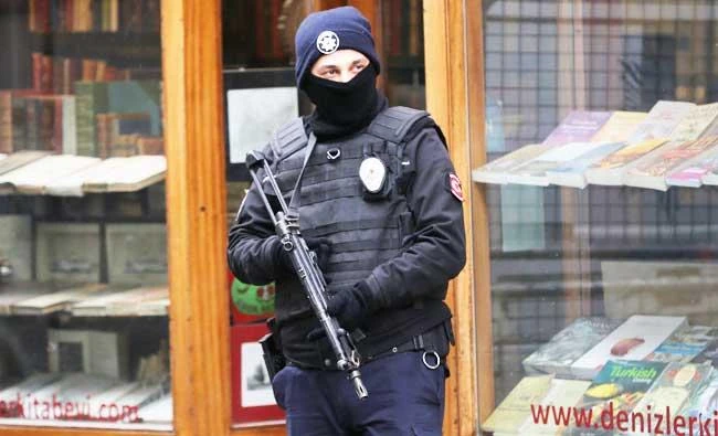 A Turkish police officers guards the area adjacent to the Dutch consulate in central Istanbul's Istiklal Avenue, the main shopping road of Istanbul, on Tuesday. (AP)