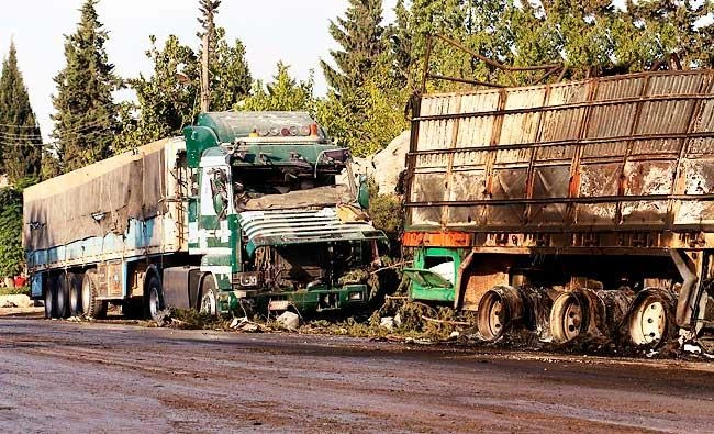 This Sept. 20, 2016, file image provided by the Syrian anti-government group Aleppo 24 news, shows damaged trucks carrying aid, in Aleppo, Syria. (AP)