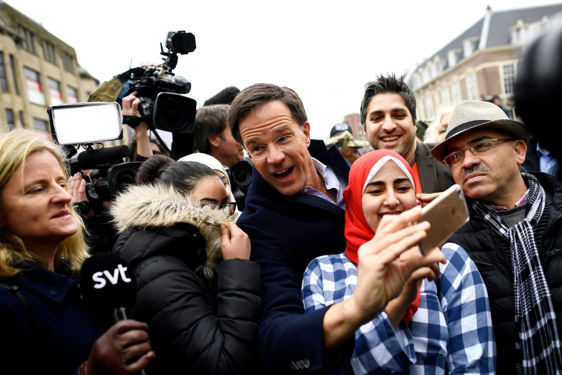 Dutch Prime Minister Mark Rutte of the VVD Liberal party greets supporters. (Reuters)