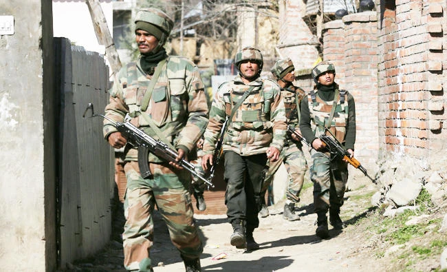 Government forces guard during a gun-battle at Haffo village, 43 Kilometers south of Srinagar, India, in this March 5, 2017 photo. (AP)