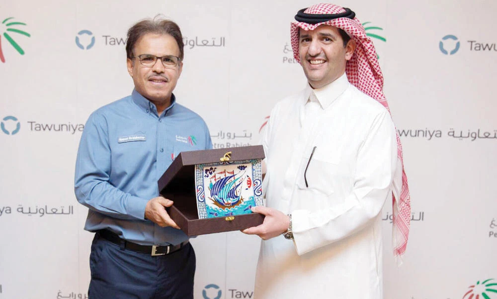 Nasser Al-Mahasher, Petro Rabigh CEO, left, and Raeed Al-Tamimi, Tawuniya CEO.