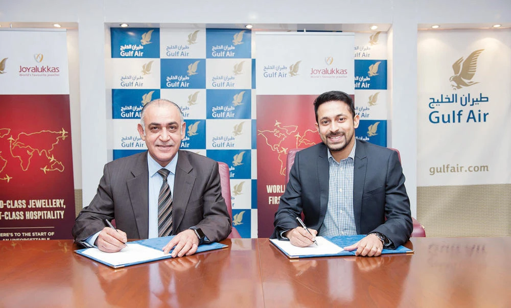 John Paul Alukkas, group executive director of Joyalukkas, right, and Ahmed Janahi, chief commercial officer of Gulf Air, at the agreement signing ceremony.