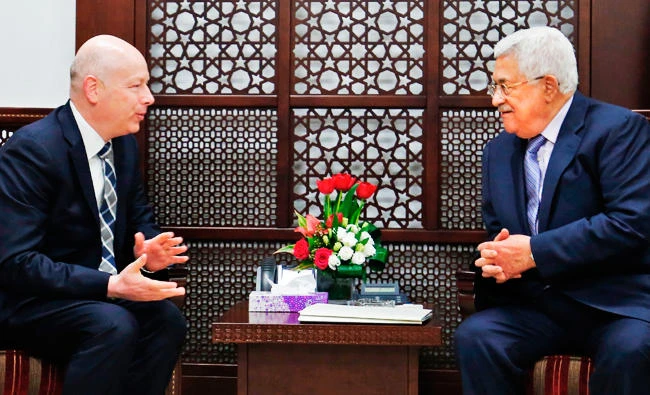 Palestinian president Mahmoud Abbas (R) meets with Jason Greenblatt, the US president's assistant and special representative for international negotiations, at his office in the West Bank city of Ramallah on TUESDAY. (AFP)
