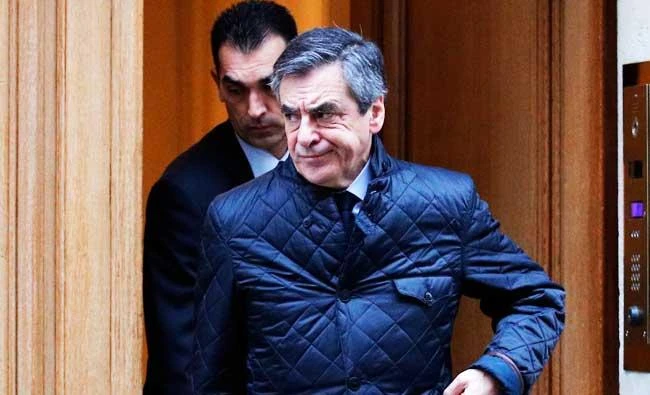 French conservative presidential candidate Francois Fillon, leaves his home in Paris, France, on Wednesday. (AP)