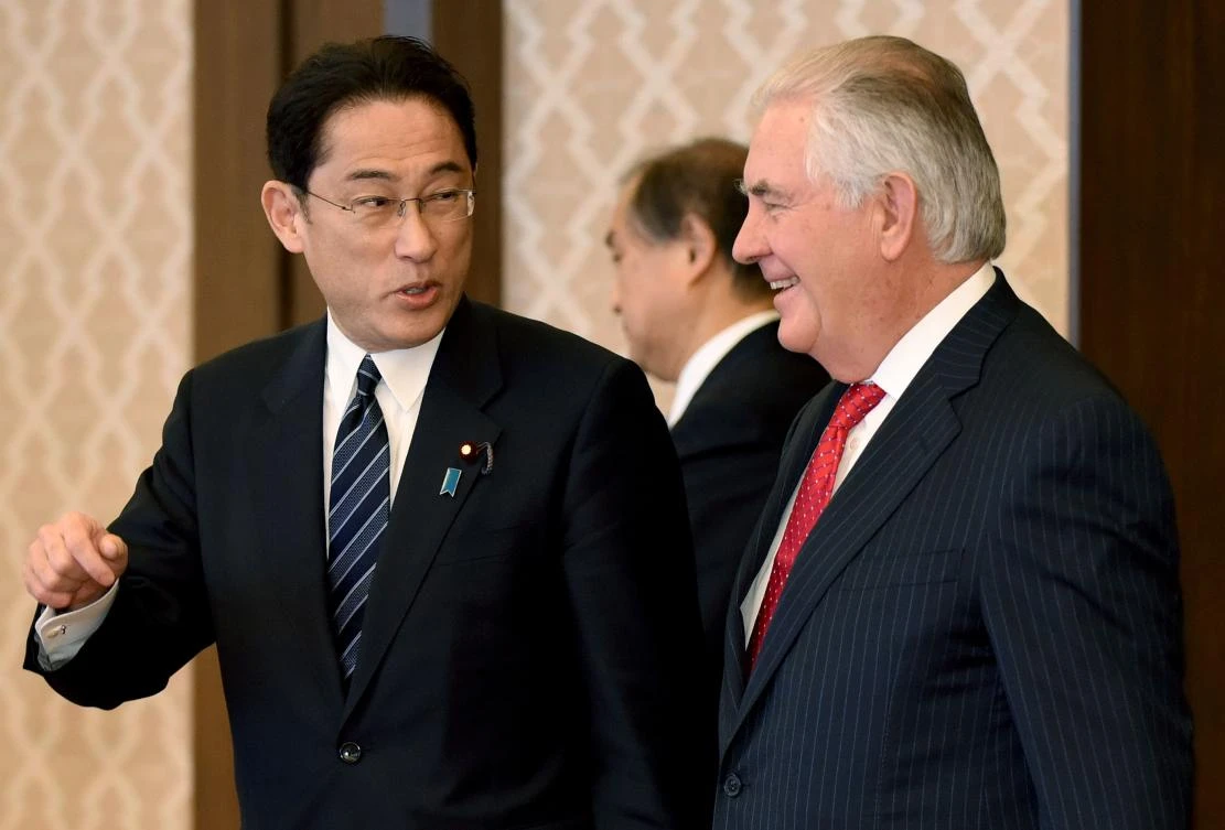US Secretary of State Rex Tillerson (R) chats with his Japanese counterpart Fumio Kishida. (AFP)