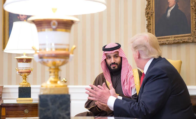US President Donald Trump talks to Saudi Arabia's Deputy Crown Prince Mohammed bin Salman.