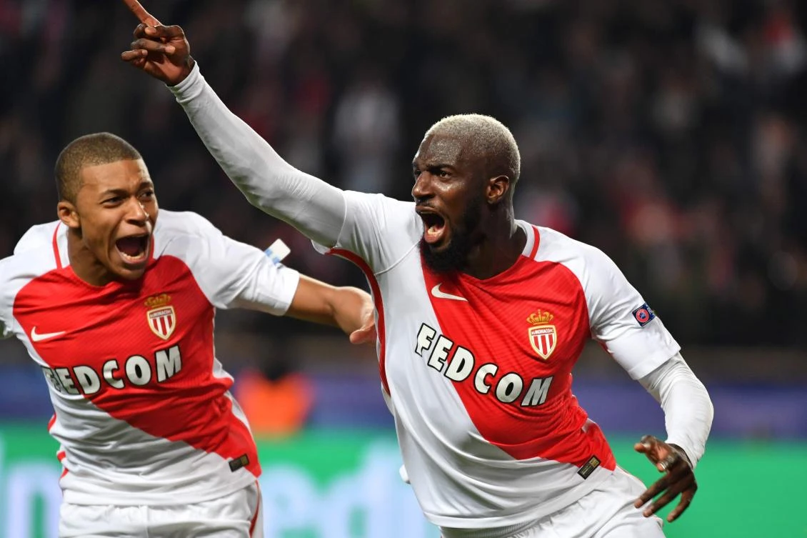 Monaco's Tiemoue Bakayoko celebrates with teammate Kylian Mbappe Lottin, left, after scoring against Manchester City at the Stade Louis II in Monaco on Wednesday night. (AFP)