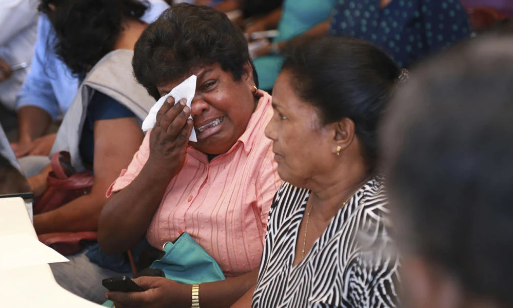 Samudra Bulathasinhala, one of the relative of a crew member who is in the captivity of Somali pirates, cries during a meeting with Sri Lankan shipping authorities in Colombo, Sri Lanka, on Thursday. (AP Photo/ Rukmal Gamage)