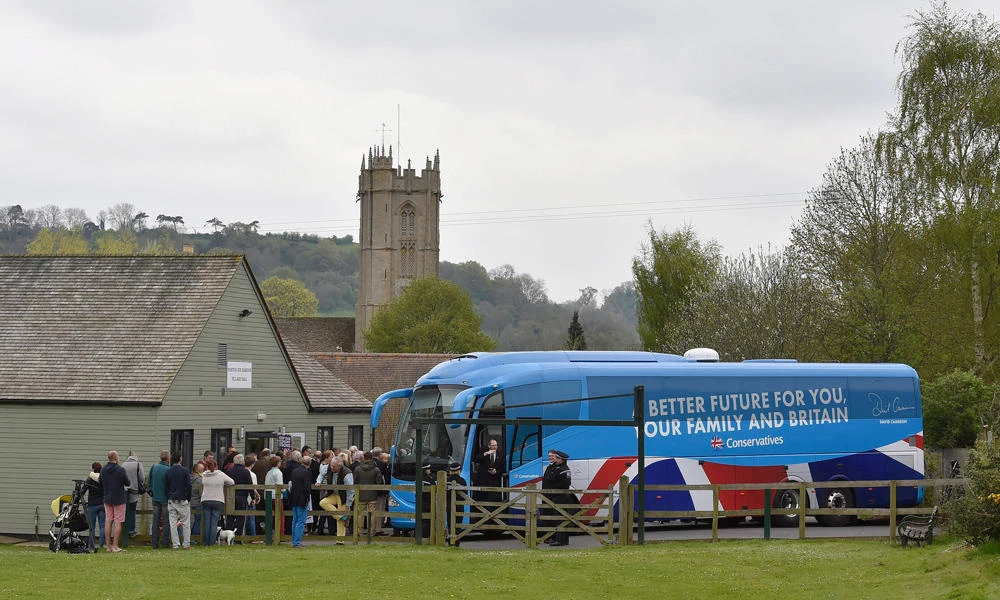 A file photo dated April 25, 2015 shows a Conservative Party campaign bus as it arrives for campaign event in Norton Sub Hamdon near Yeovil, south west England. (AFP)