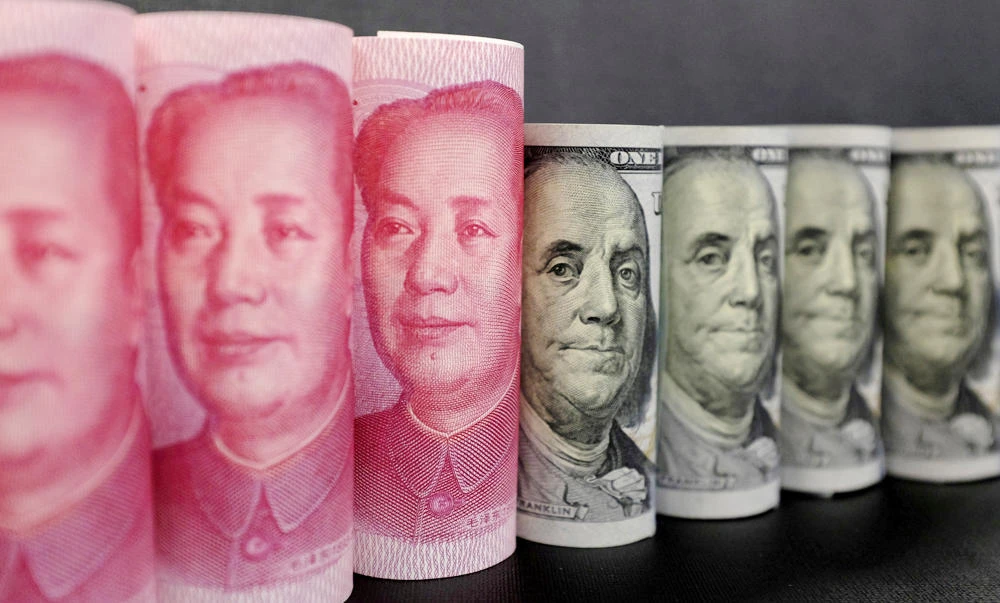 Chinese yuan banknotes and US dollar banknotes and are seen in this picture illustration in Beijing, China. (REUTERS/Jason Lee/Illustration/File Photo)
