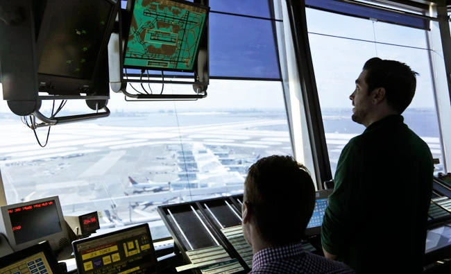 Air traffic controllers work in the tower at John F. Kennedy International Airport in New York, on Thursday. (AP)