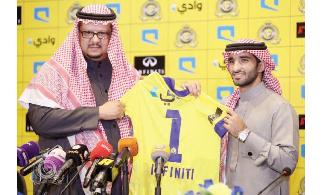 Prince Faisal bin Turki bin Nasser, left, chairman of Al Nassr Football Club signd a partnership agreement