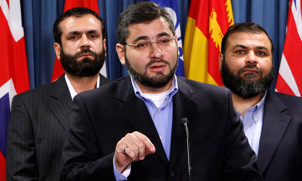 Abdullah Almalki (C), with Muayyed Nureddin (L) and Ahmad El Maati, speaks during a news conference on Parliament Hill in Ottawa October 12, 2007. The men who allege they were tortured in Syria because of information provided by Canadian authorities demanded on Friday that a secret investigation into their case be opened up to the public. (REUTERS/Chris Wattie/File Photo)