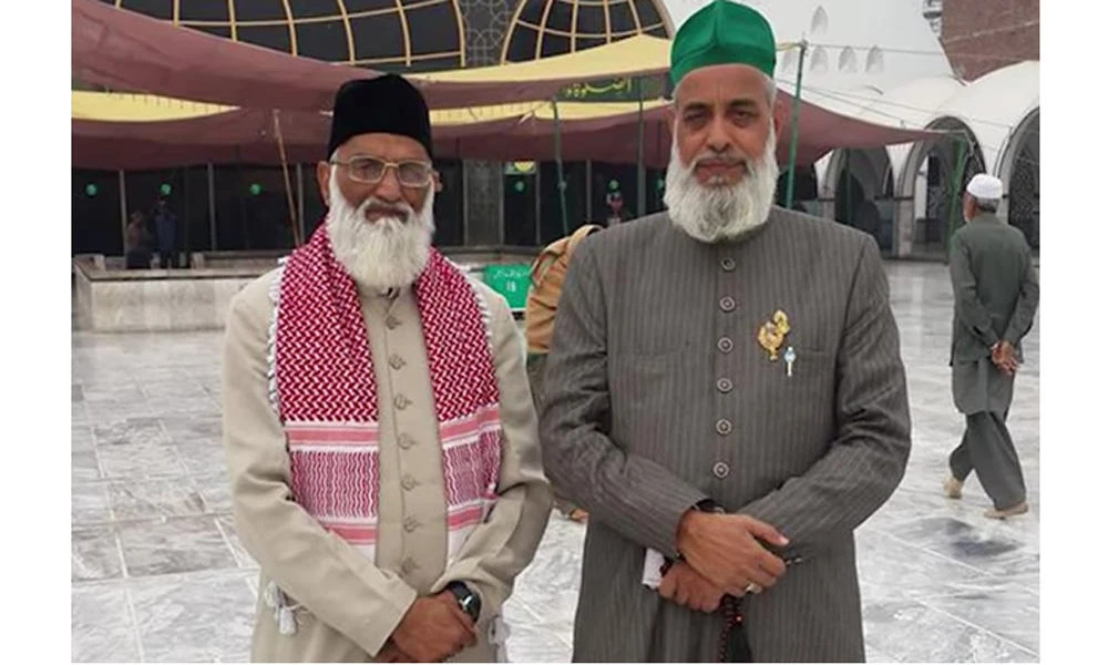 A screen grab from a WION video posted on YouTube shows Indian Sufi cleric Syed Asif Ali Nizami (left) and his nephew Nazim Ali Nizami in front of a shrine in New Delhi. (Courtesy of World is One News)