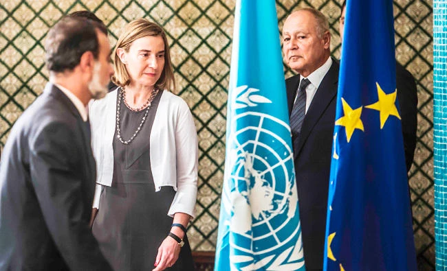 EU foreign policy chief Federica Mogherini (L) and Arab League Secretary General Ahmed Abul-Gheit arrive to attend a joint press conference on Libya with African Union special envoy to Libya Jakaya Kikwete (unseen), UN envoy to Libya Martin Kobler (unseen), at the Arab League headquarters in the Egyptian capital Cairo on Saturday. (AFP)