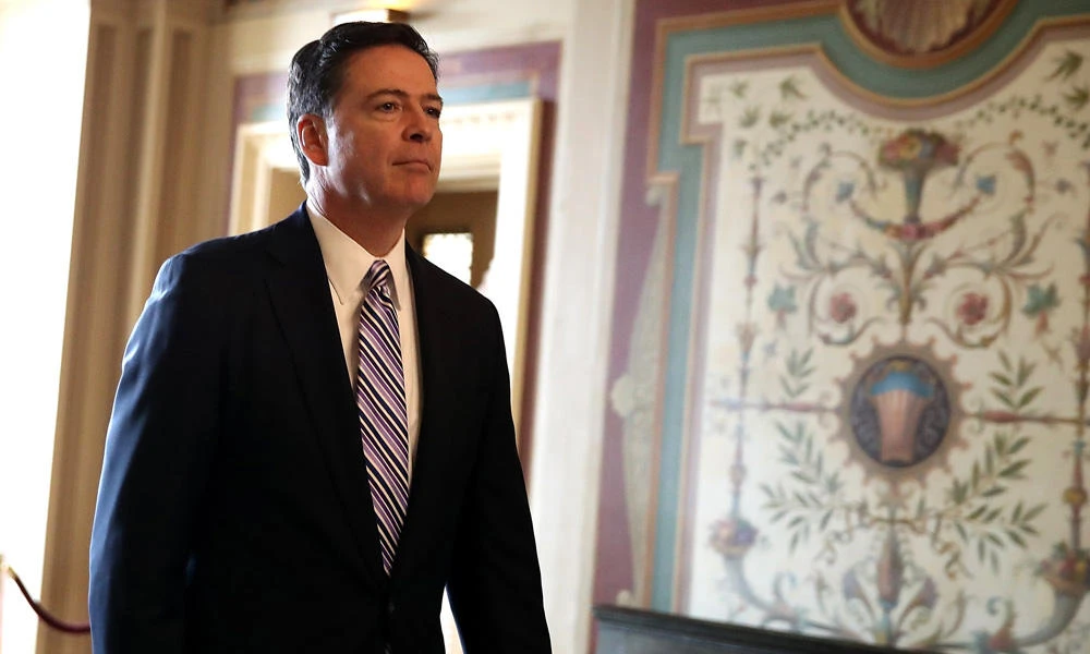 FBI Director James Comey leaves a closed door meeting with Senators at the US Capitol on March 15, 2017 in Washington, DC. Comey will be in the hot seat again Monday, facing lawmakers who accuse him of stonewalling Congress, as they demand answers about Donald Trump’s potential Russia ties and the president’s extraordinary accusation of wiretapping by his predecessor. (Justin Sullivan/Getty Images/AFP)