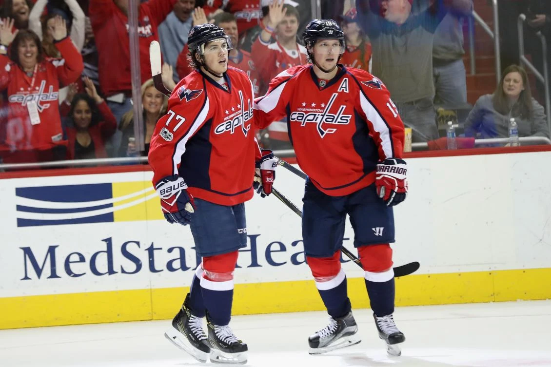 T.J. Oshie (77) and Nicklas Backstrom of the Washington Capitals celebrate beating the Tampa Bay Lightning on Saturday night. (AFP)