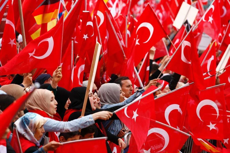 Protesters wave Turkish flags during a pro-Turkey rally in Cologne, Germany. (REUTERS)