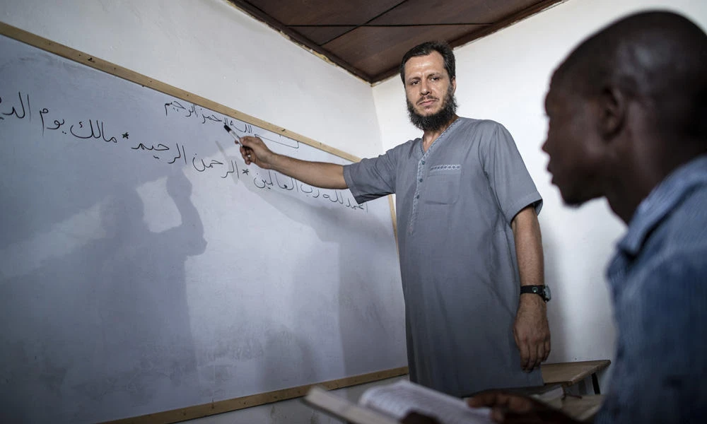 In this photo taken Saturday,Abdul Ghani Bandenjki, teaches Arabic and the Quran, in a School in Tema, Ghana. Bandenjki first visited Ghana in 2006 after being invited to officiate at prayers during the Ramadan holy month. When fighting broke out in Syria five years later, Bandenjki decided to return to this West African nation more than 3,000 miles (4,825 kilometers) away. (AP Photo/ Jordi Perdigo)