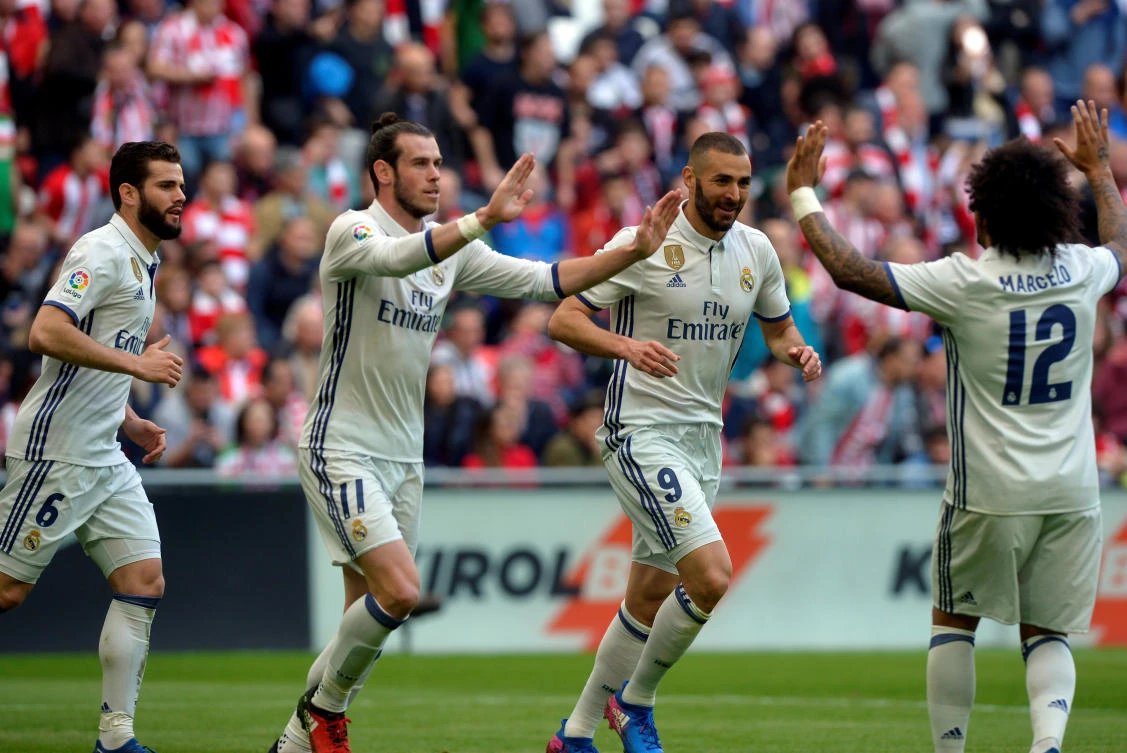 Real Madrid's Nacho, Gareth Bale, Karim Benzema and Marcelo Vieira da Silva celebrate celebrate their team's win over Athletic Bilbao on Saturday night. (Reuters)