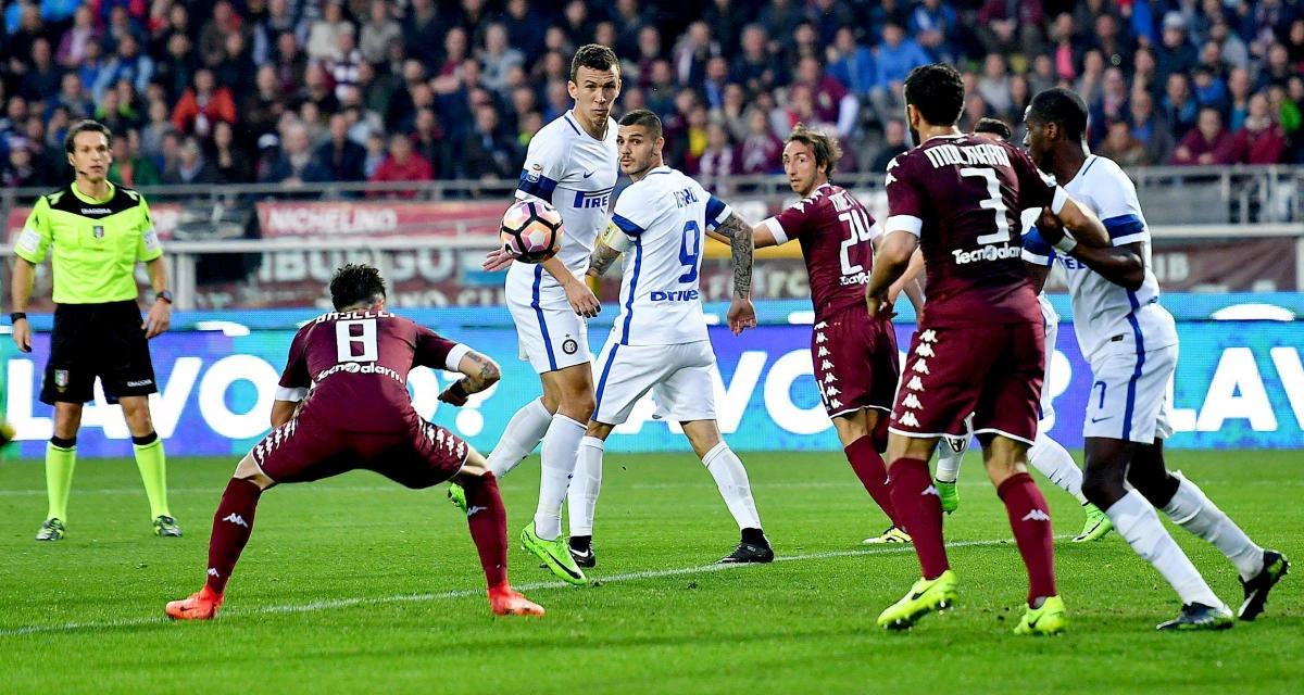 Torino's Daniele Baselli, left, scores against Inter Milan during an Italian Serie A match at the Olympic Stadium in Turin on Saturday night. (AP)