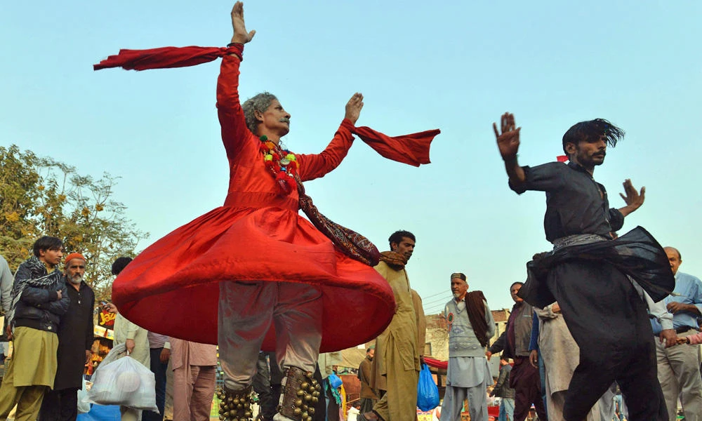 In this November 19, 2016 photo, Sufis dance outside the Data Darbar complex during the three-day annual 'Urs' religious festival in Lahore, Pakistan. Two prominent Indian Sufi leaders who were reported missing during a visit to Pakistan earlier this month have returned safely, saying they were traveling in a remote area with no cellular service. (AFP file photo)