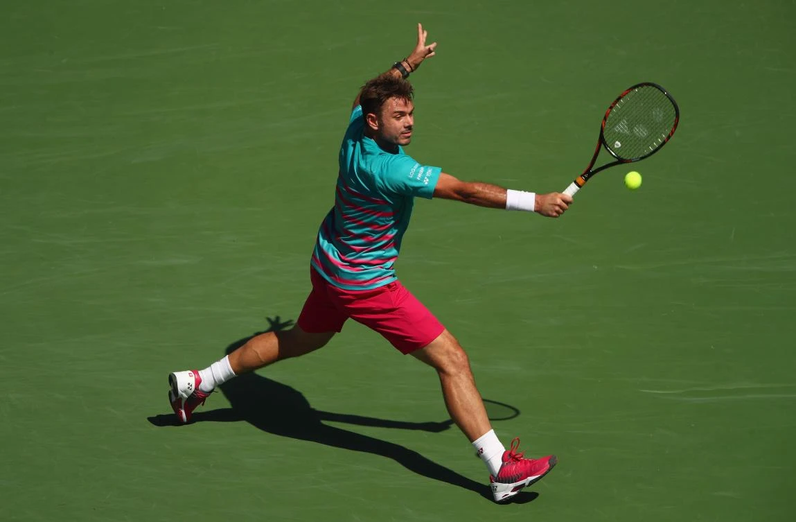 Stanislas Wawrinka plays a backhand against Pablo Carreno Busta in their semifinal match on Saturday night. (AFP)