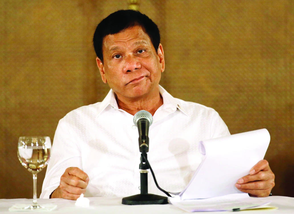 Philippine President Rodrigo Duterte reacts during a press conference in Manila in this March 13 file photo. (AP)
