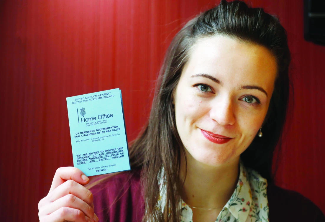 Dora-Olivia Vicol from Romania said she spent weeks trying to get a document from her homeland to prove she had health coverage in Britain. (AP)