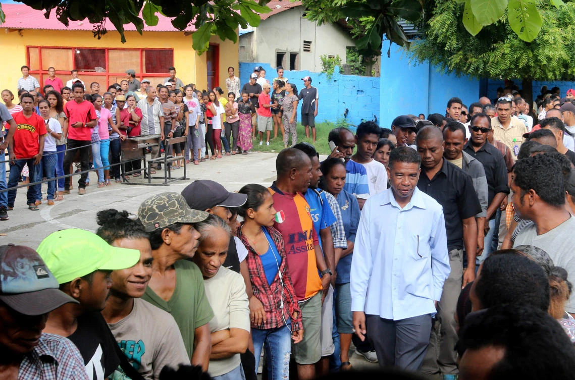 East Timor presidential candidate Antonio da Conceicao from the Democratic Party (R) arrives to cast his ballot during the presidential election at a polling station in Dili, East Timor. (Reuters)