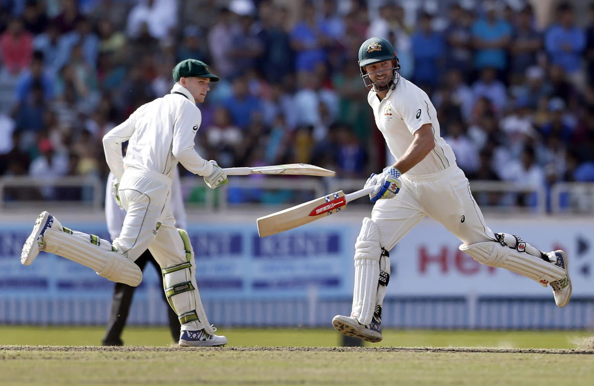 Australia's Shaun Marsh, right, and Peter Handscomb run between the wickets during the fifth day of their third Test match against in Ranchi on Monday. (AP)