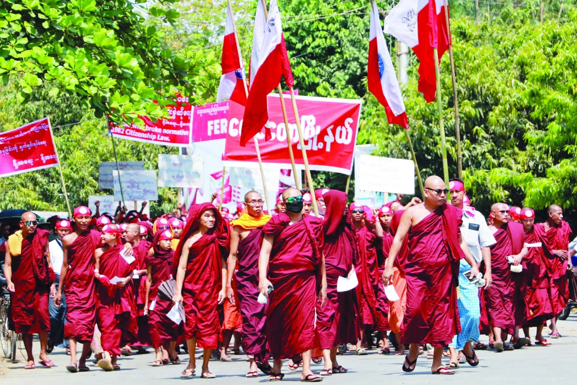 Extremist monks demonstrate against a government push to speed up the citizenship verification process for the stateless Rohingya minority in Sittwe, Myanmar, on Sunday. (AFP)